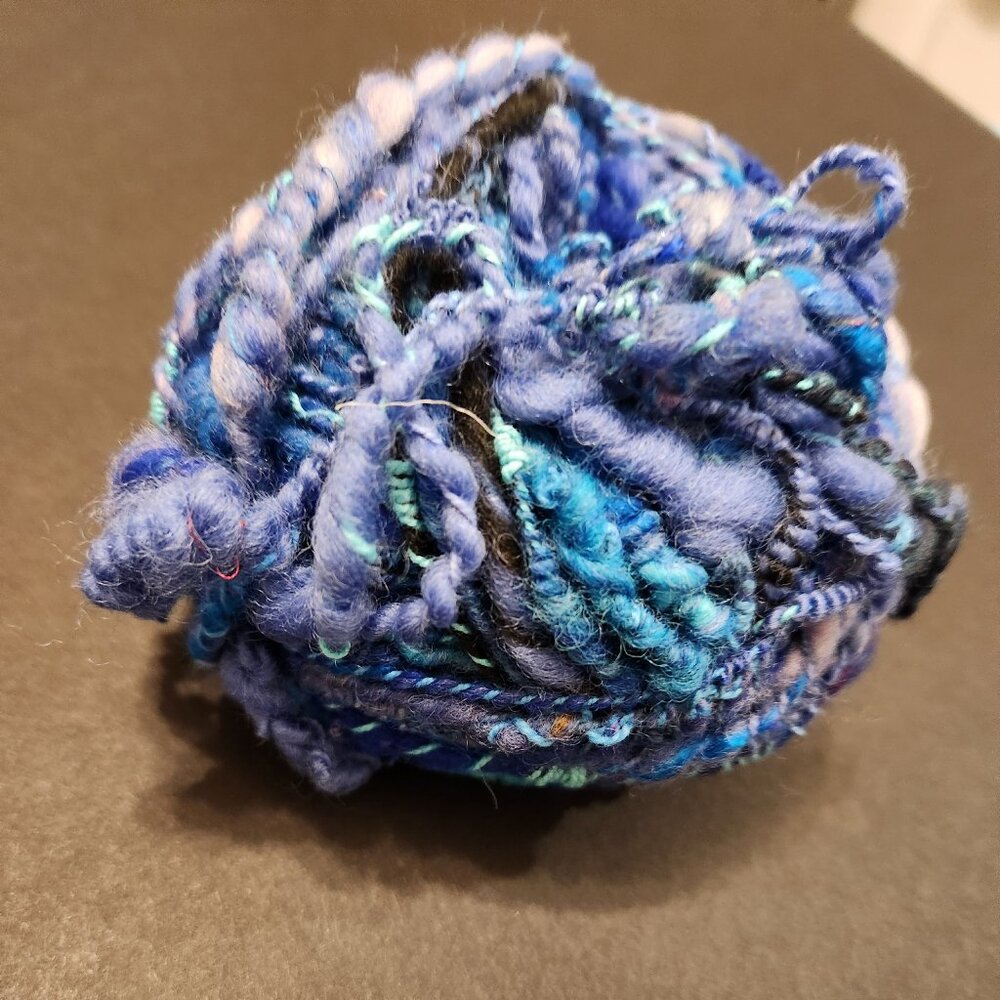 Handmade art yarn, 1.6oz, super fine wool, in shades of blue.